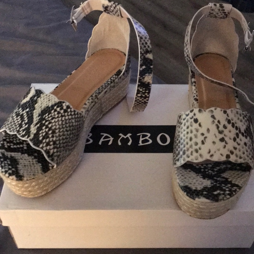 New, flatform python print sandals never worn.